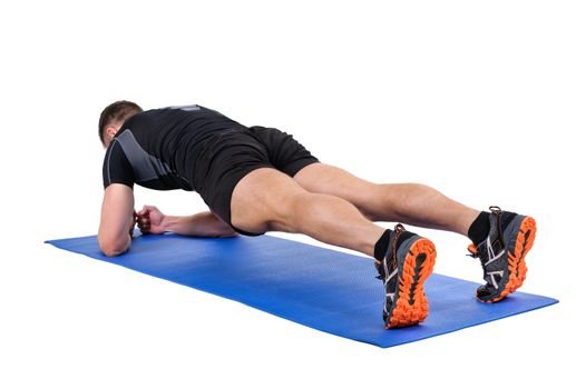 Young man shows Elbow Plank Workout, isolated on white, view from behind