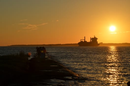 A ship heading into the fading sun. Shot taken along the Cape Fear River in North Carolina.