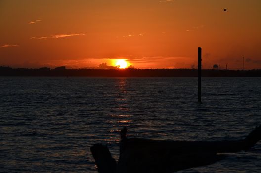 A blazing orange sky over the ocean in North Carolina