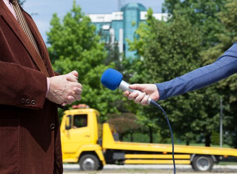 Journalist making interview with businessperson or politician