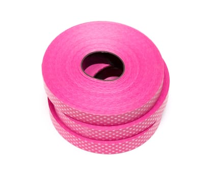 Pink red plastic ribbon on white background
