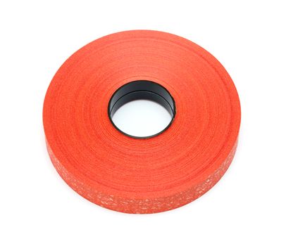 Roll red plastic ribbon on white background