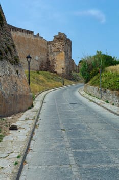 Road among the ruins of the old castle