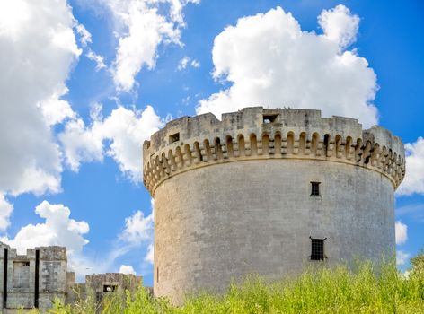 rovine of medieval old tower of castle under blue sky with cloud in Matera Italy