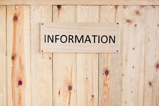 Wording Information sign on wood board.