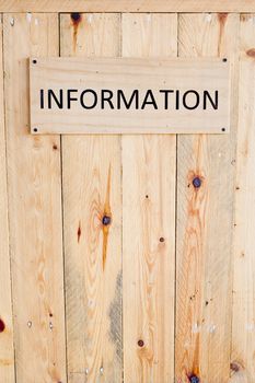Wording Information sign on wood board.