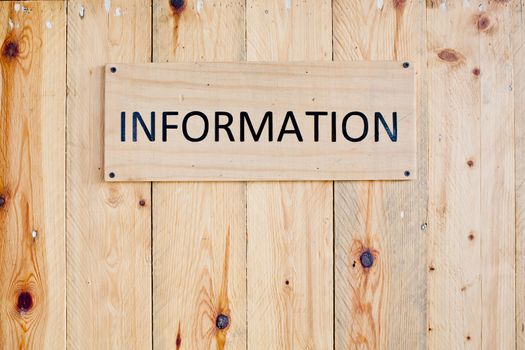 Wording Information sign on wood board.