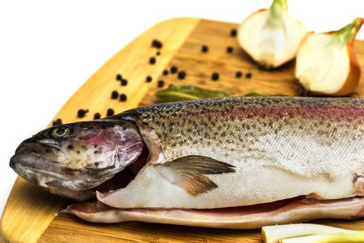 Fresh Salmon trout with bay leaf, black pepper and onion isolated