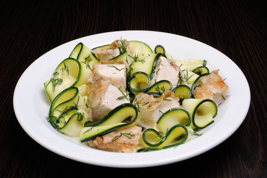 Ribbons of zucchini with slices of chicken in milk sauce