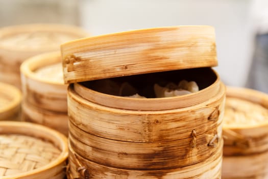 Chinese dumplings with meat and cabbage, steamed with bamboo steamer