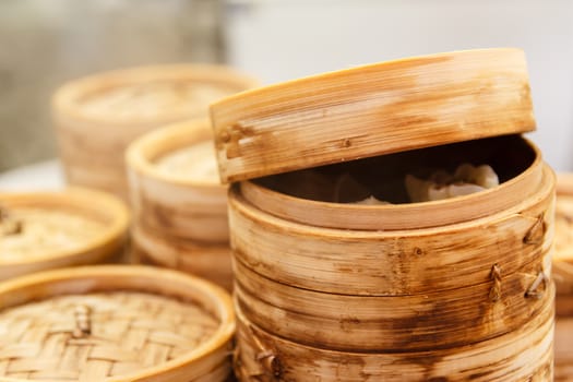 Chinese dumplings with meat and cabbage, steamed with bamboo steamer