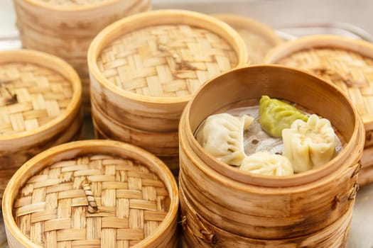 Chinese dumplings with meat and cabbage, steamed with bamboo steamer