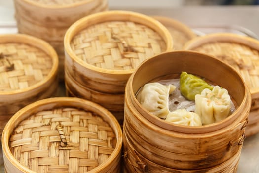 Chinese dumplings with meat and cabbage, steamed with bamboo steamer