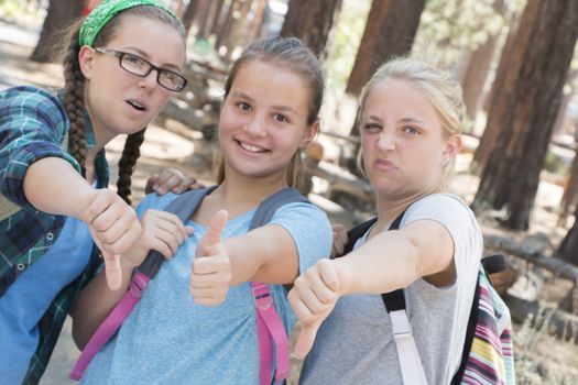 Young Girls with Thumbs up and down