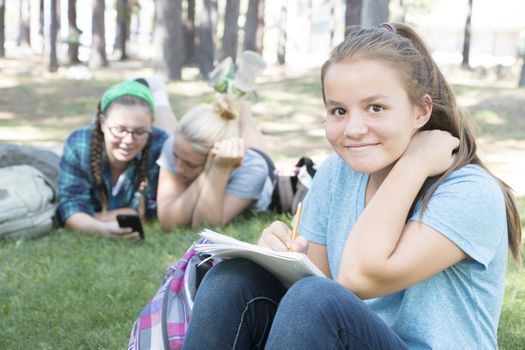 Young Girls Studying at the Park