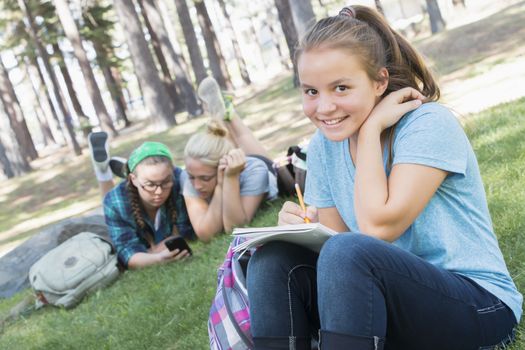 Young Girls Studying at the Park