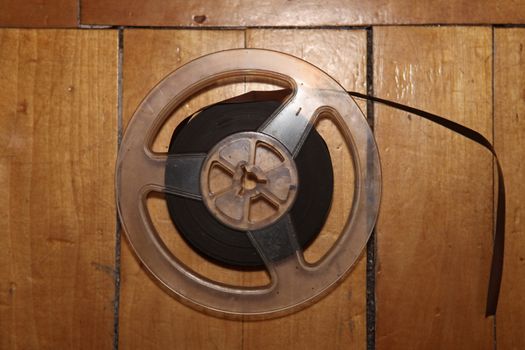 reel for reel tape player and recorder on wooden background