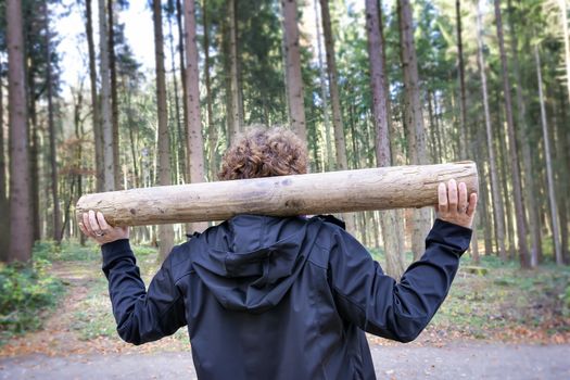 Image of woman is doing fitness exercises in forest