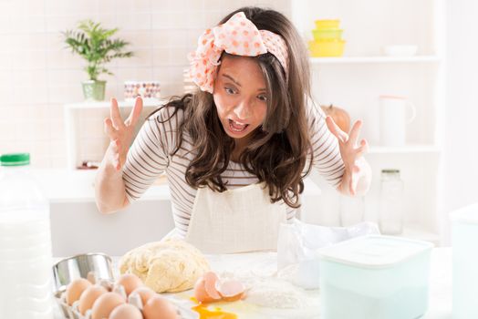 Frustrated Young woman making dough