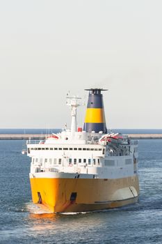 Front view of a ship floating in a harbor