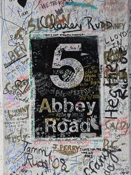 Abbey Road studio gate post with messages and signatures from fans Worldwide