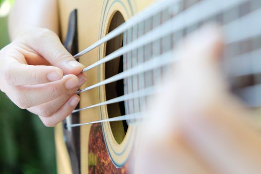 close up of 5 string acoustic bass guitar.