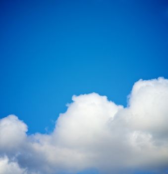 Big Fluffy White Clouds on Clear Blue Sky background Outdoors