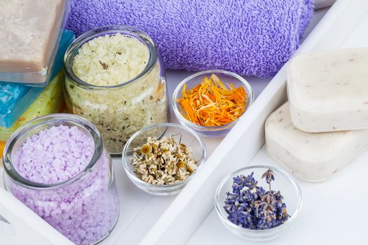 various kinds of bath salt with flowers, on white background