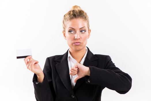 Businesswoman showing thumbs down and holding a credit card.