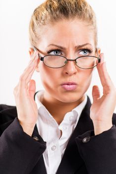 Portrait of attractive businesswoman with glasses. She is worried.