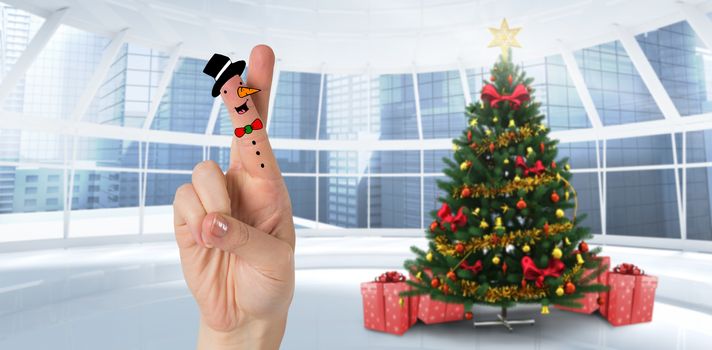 Christmas fingers against home with christmas tree