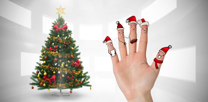 Christmas caroler fingers against home with christmas tree