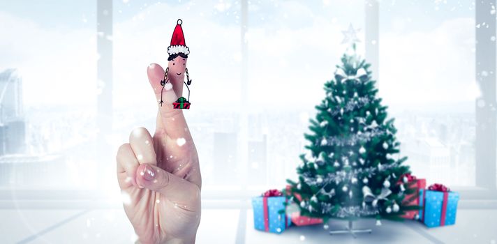 Christmas fingers against home with christmas tree