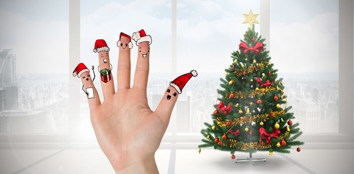 Christmas caroler fingers against home with christmas tree