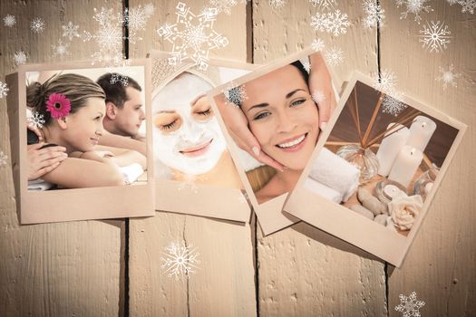 Cheerful young couple enjoying a Spa treatment against spa objects on wooden floor