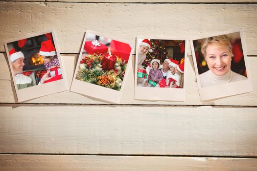 Instant photos on wooden floor against portrait of a smiling active seniors at christmas