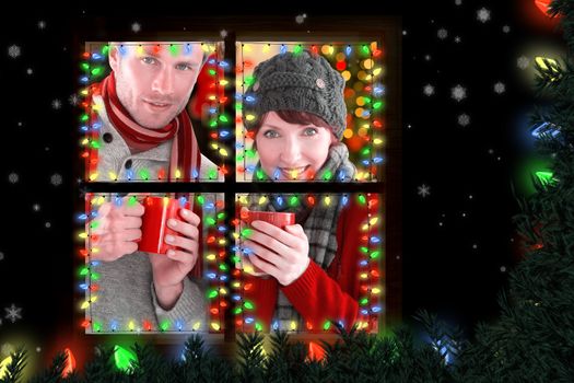 Couple both having warm drinks against bleached wooden planks background