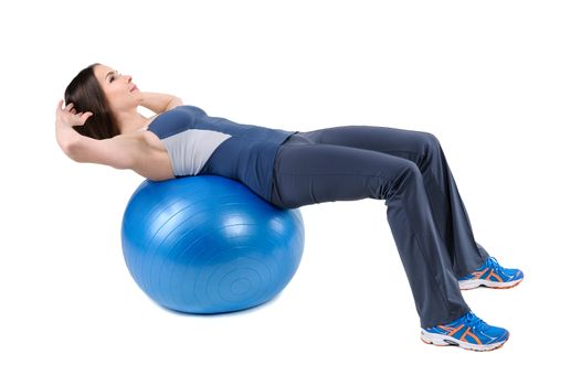 Young woman shows starting position of Abdominal Fitball Workout, isolated on white
