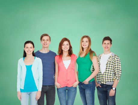 education and people concept - group of smiling students standing