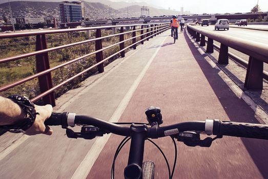 Photograph of some cyclists on a urban bicycle track