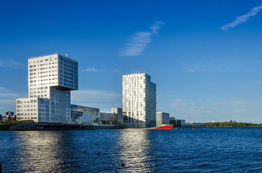 Almere, Netherlands - May 5, 2015: Skyline apartment buildings of Almere Stad, Netherlands - Silverline, The wave and Almere Towers at Weer Water