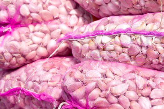 Bags of garlic in the market