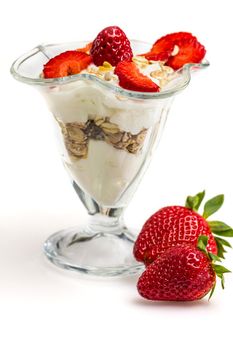 Glass of Muesli with strawberries and yogurt