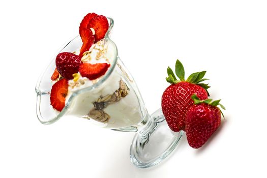 Glass of Muesli with strawberries and yogurt