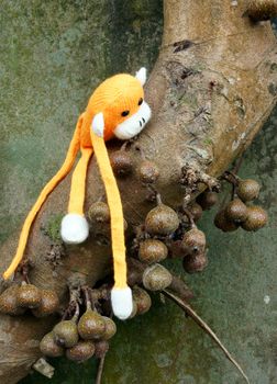 Amazing scene with group of knitted monkey climb tree, 2016 is year of the monkey, monkey symbol in colorful yarn to happy new year