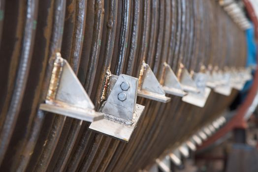 Close-up of industrial disk drier. Extremely shallow depth of field with only one disk in focus.