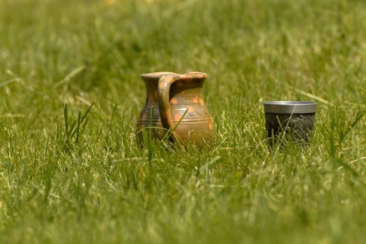 Decorative clay pot in the grass