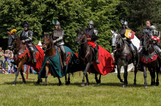 CHORZOW,POLAND, JUNE 9: 5 medieval knights on horsebacks during a IV Convention of Christian Knighthood on June 9, 2013, in Chorzow