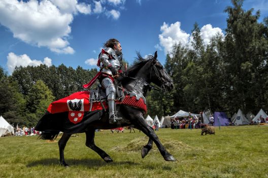 CHORZOW,POLAND, JUNE 9: Medieval knight on horseback during a IV Convention of Christian Knighthood on June 9, 2013, in Chorzow