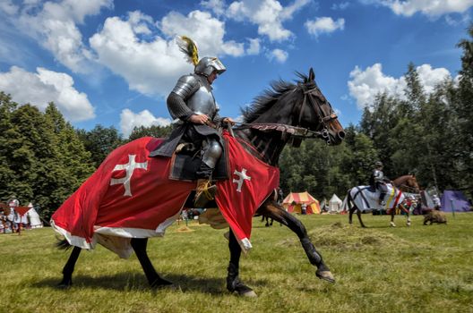 CHORZOW,POLAND, JUNE 9: Medieval knight on horseback during a IV Convention of Christian Knighthood on June 9, 2013, in Chorzow